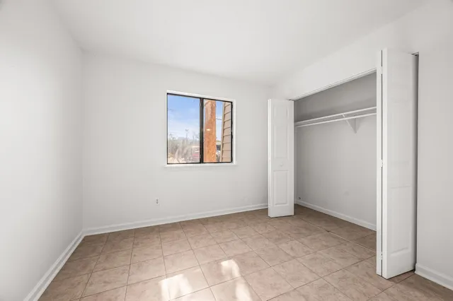 a view of a bathroom from a corridor