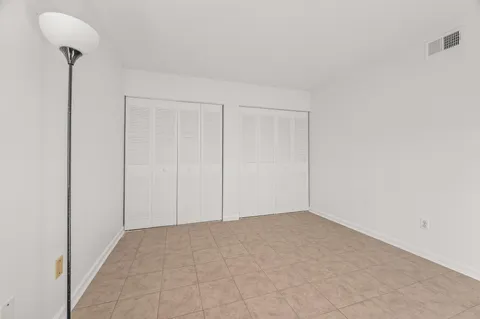 a view of an empty room with windows