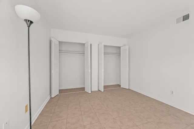 a bathroom with a sink toilet and a mirror