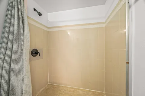 a view of an empty room with windows