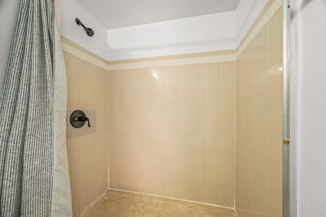 a view of an empty room with windows