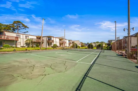 a view of a swimming pool and an outdoor seating