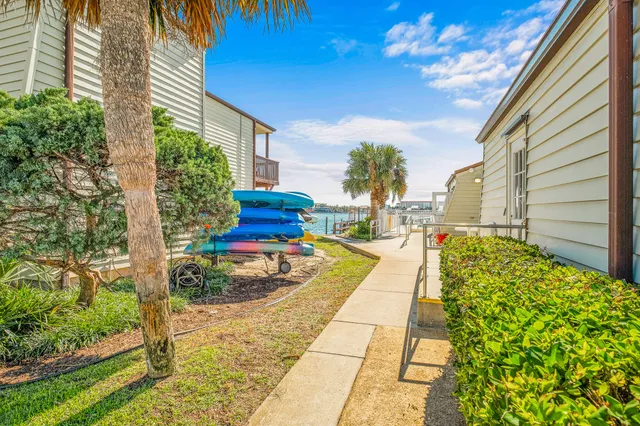 a view of swimming pool with outdoor seating and city view
