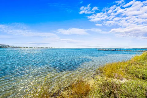 a room with pool table and windows