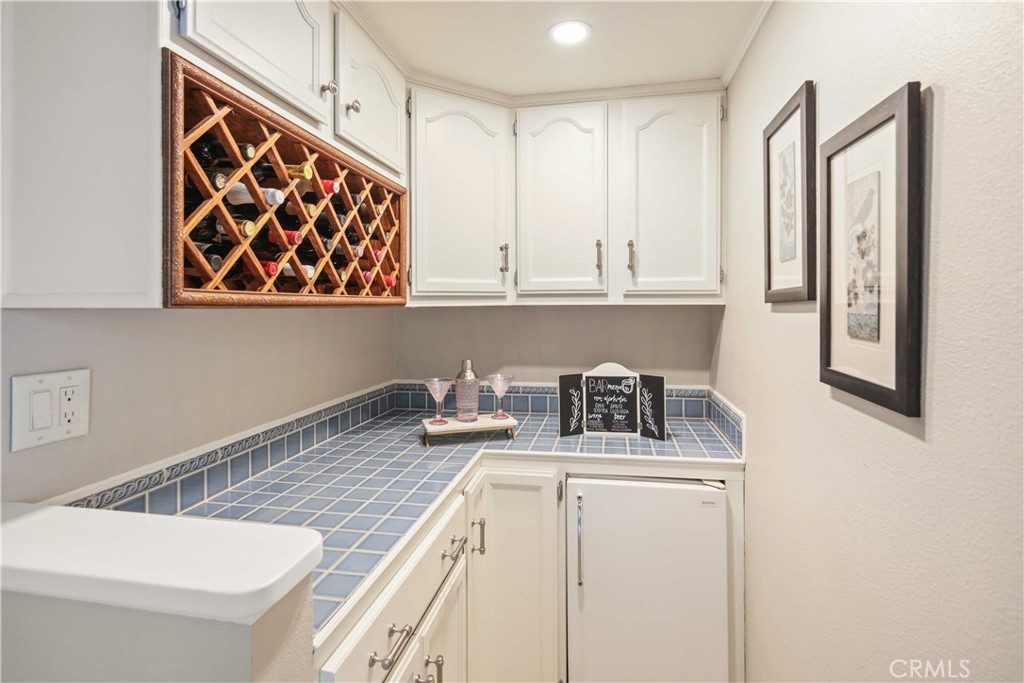 18836 Cedar Valley Way Newhall, CA 91321 - Photo 31 of 48 a kitchen with a stove and a white refrigerator