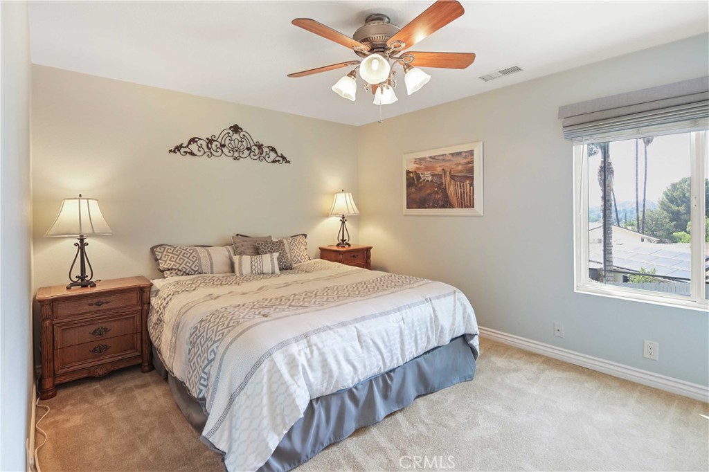18836 Cedar Valley Way Newhall, CA 91321 - Photo 34 of 48 a bedroom with a bed and a window