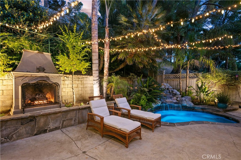 18836 Cedar Valley Way Newhall, CA 91321 - Photo 5 of 48 a backyard of a house with yard fire pit and outdoor seating