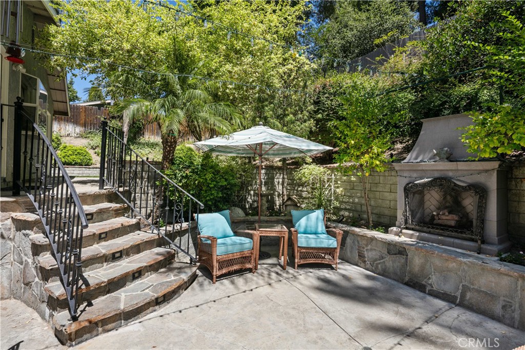 18836 Cedar Valley Way Newhall, CA 91321 - Photo 8 of 48 a backyard of a house with table and chairs