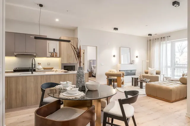 a kitchen with a dining table and chairs