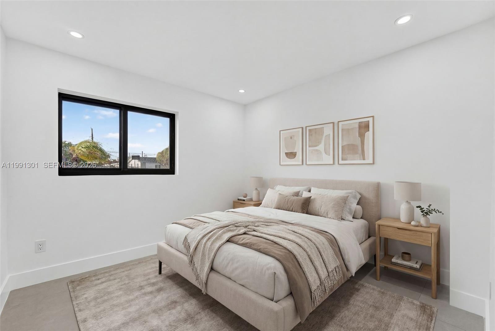 10445 Southwest 149th Terrace Miami, FL 33176 - Photo 11 of 19 a bedroom with a bed and a painting on the wall