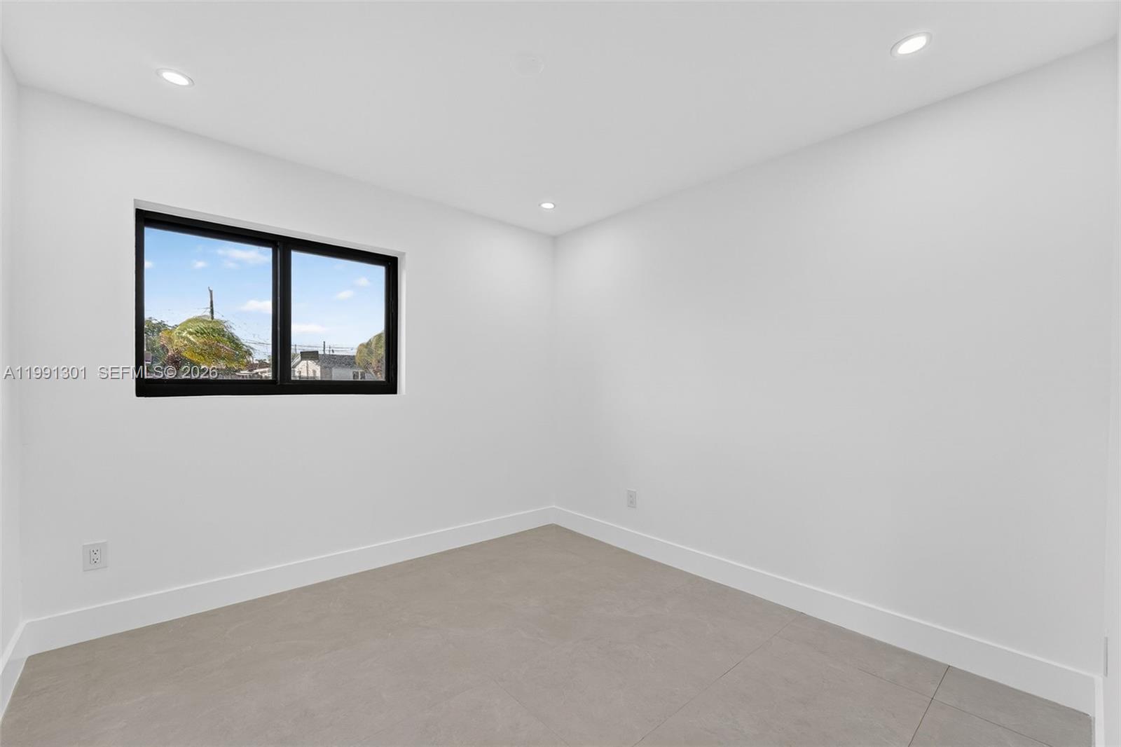 10445 Southwest 149th Terrace Miami, FL 33176 - Photo 12 of 19 an empty room with a window