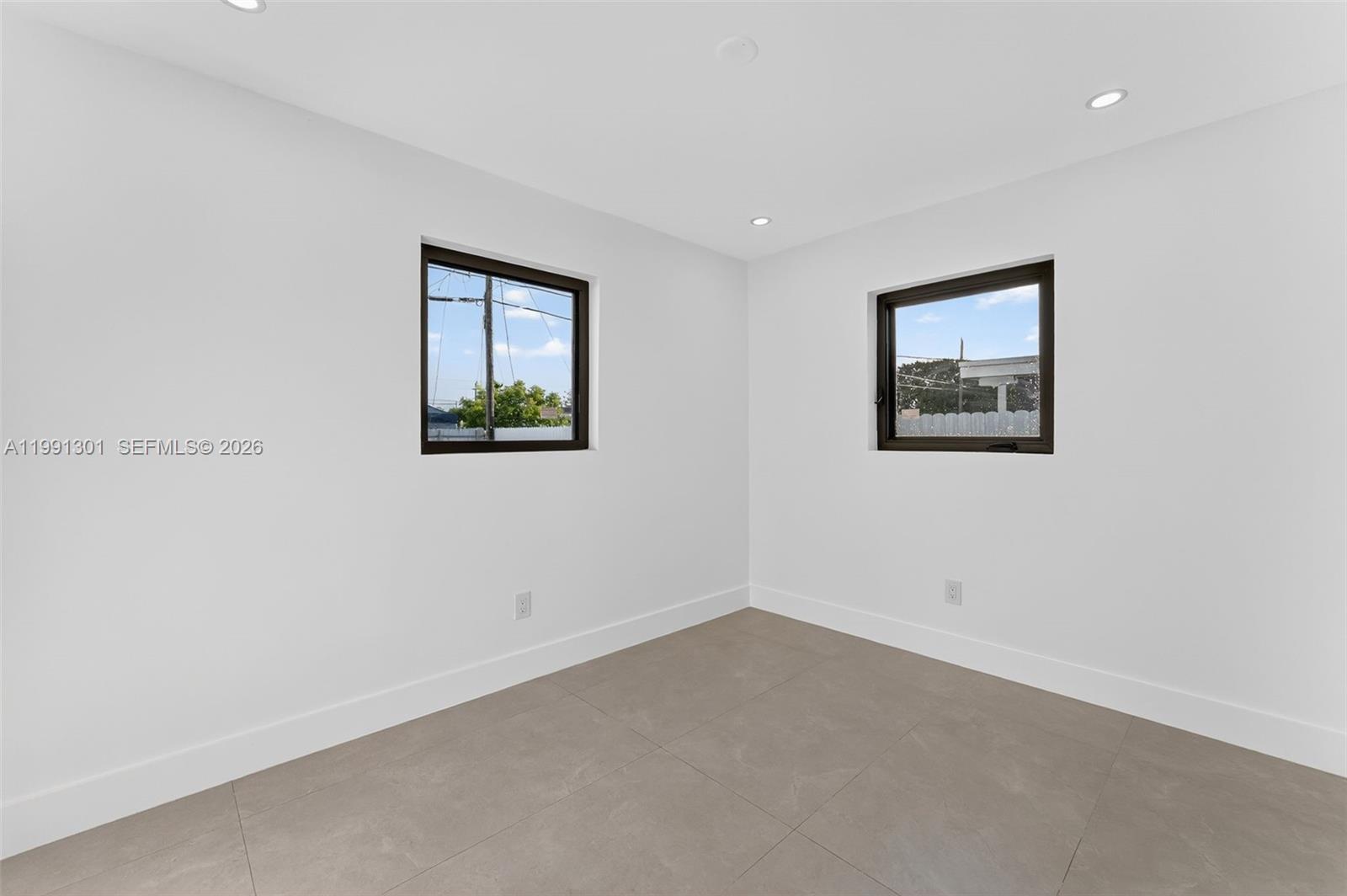 10445 Southwest 149th Terrace Miami, FL 33176 - Photo 15 of 19 an empty room with a window