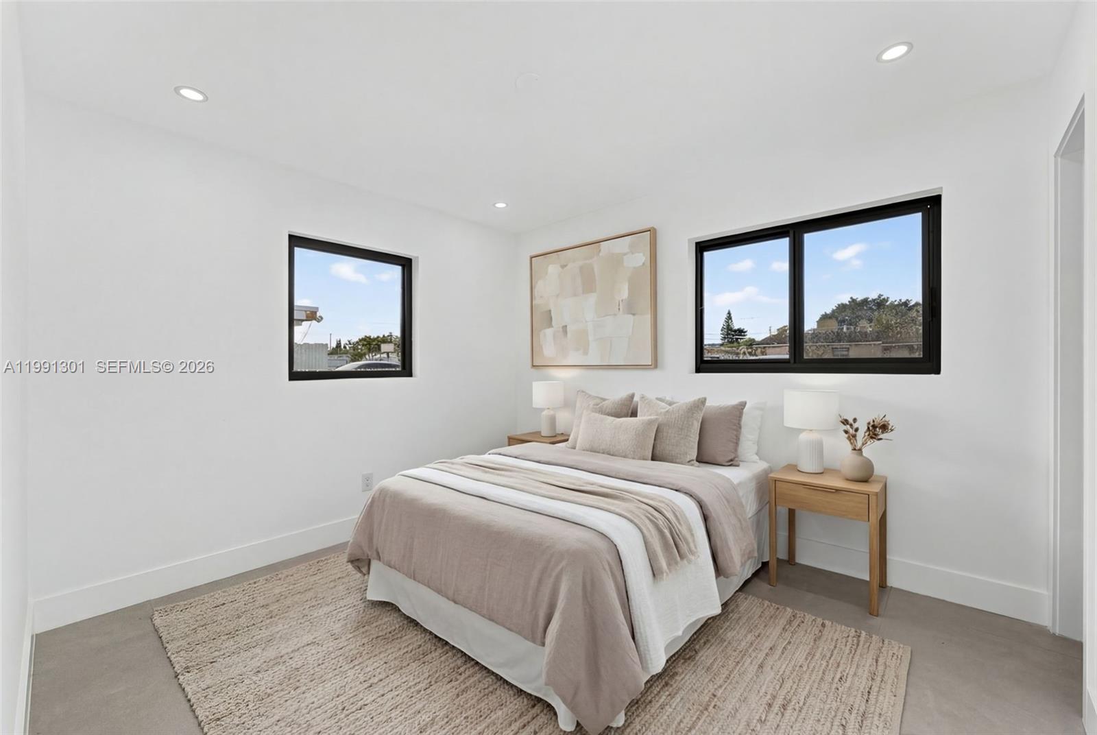 10445 Southwest 149th Terrace Miami, FL 33176 - Photo 16 of 19 a bedroom with a bed and a window