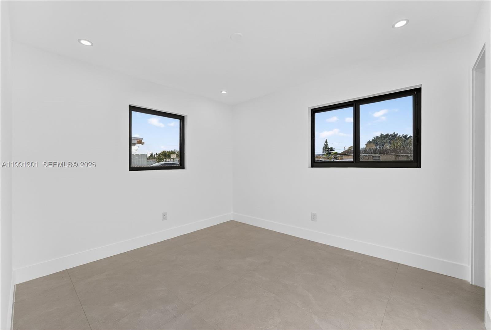 10445 Southwest 149th Terrace Miami, FL 33176 - Photo 17 of 19 an empty room with windows