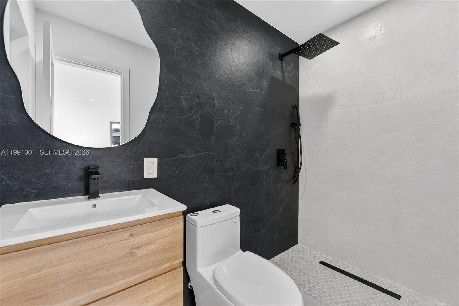 10445 Southwest 149th Terrace Miami, FL 33176 - Photo 18 of 19 a bathroom with a toilet a sink and mirror