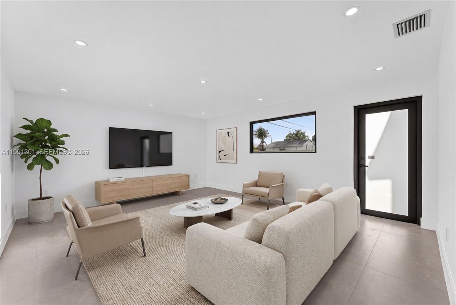 10445 Southwest 149th Terrace Miami, FL 33176 - Photo 6 of 19 a living room with furniture and a flat screen tv