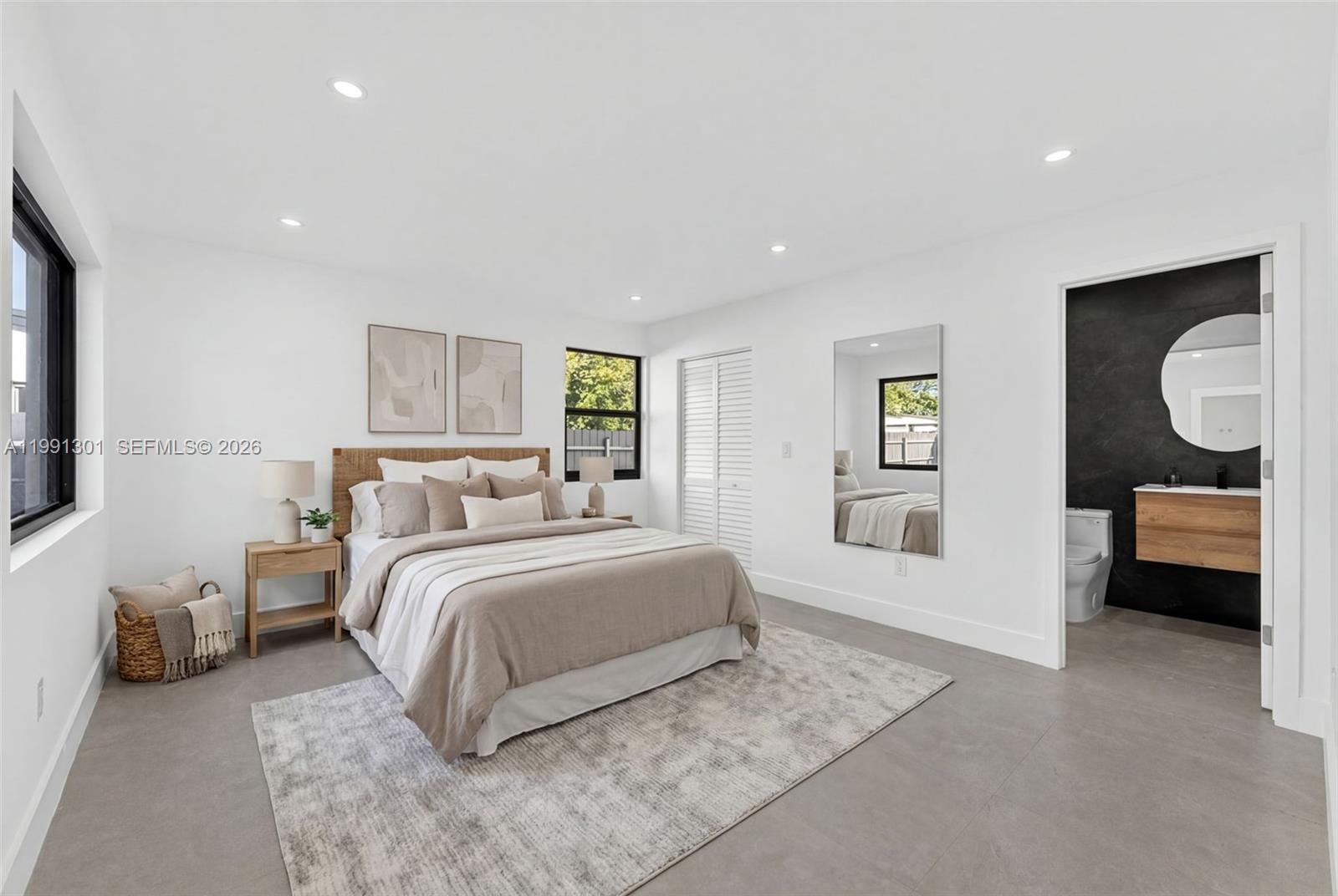 10445 Southwest 149th Terrace Miami, FL 33176 - Photo 8 of 19 a spacious bedroom with a bed and a couch