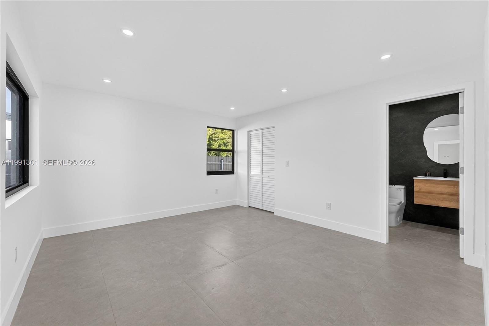 10445 Southwest 149th Terrace Miami, FL 33176 - Photo 9 of 19 a view of an empty room with a window