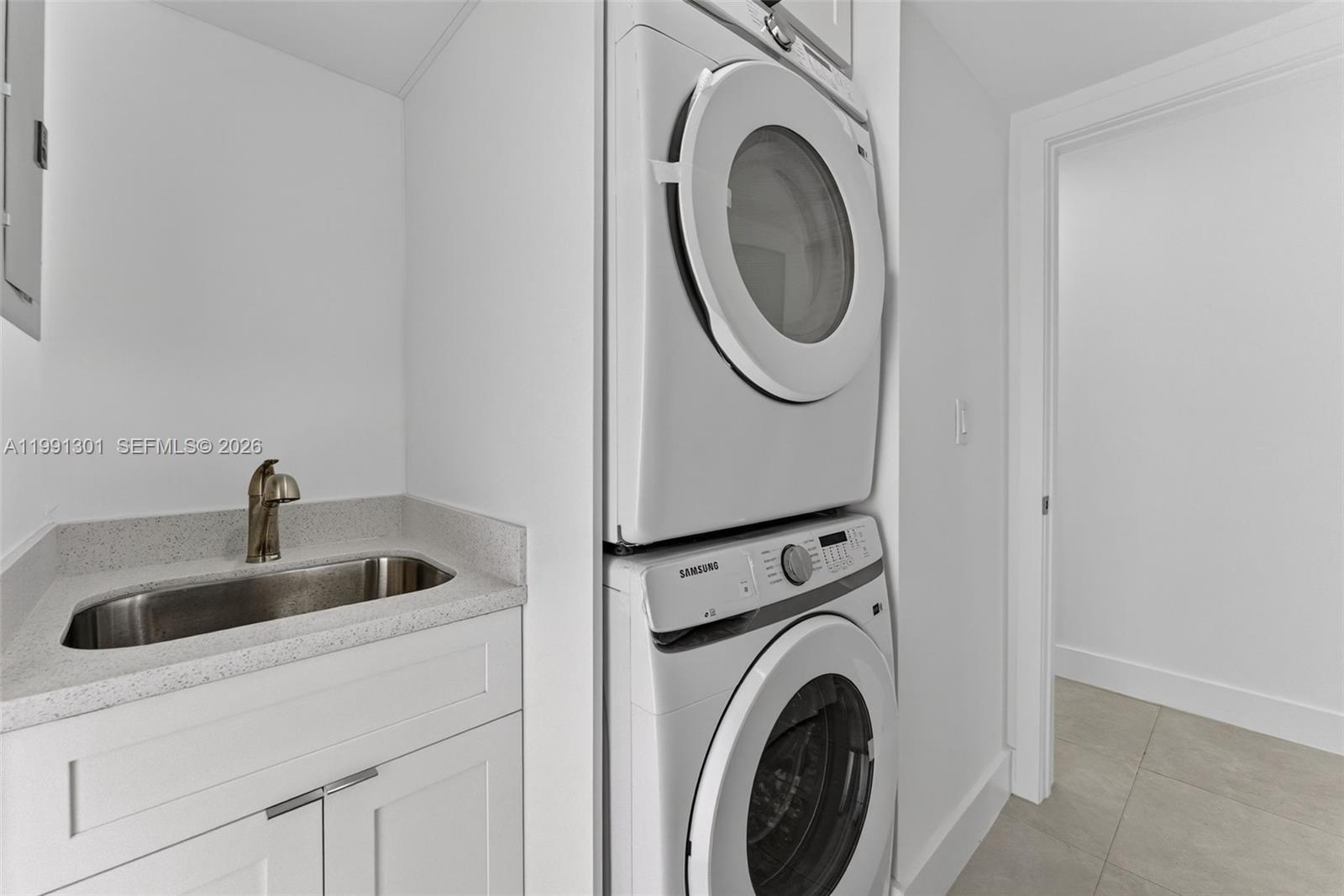 10445 Southwest 149th Terrace Miami, FL 33176 - Photo 10 of 19 a utility room with dryer and washer