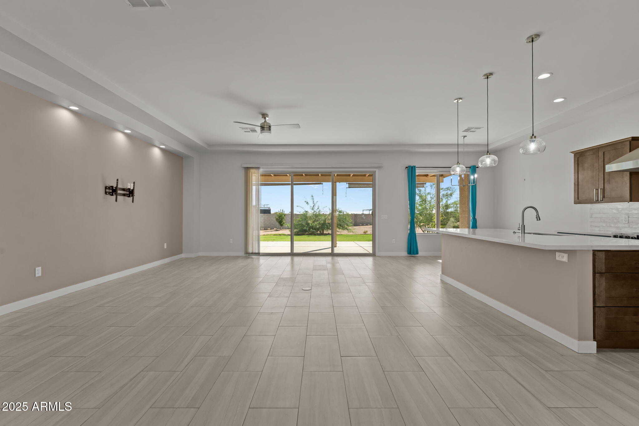 23012 Peak View Road Wittmann, AZ 85361 - Photo 14 of 44 a view of an empty room with window and wooden floor