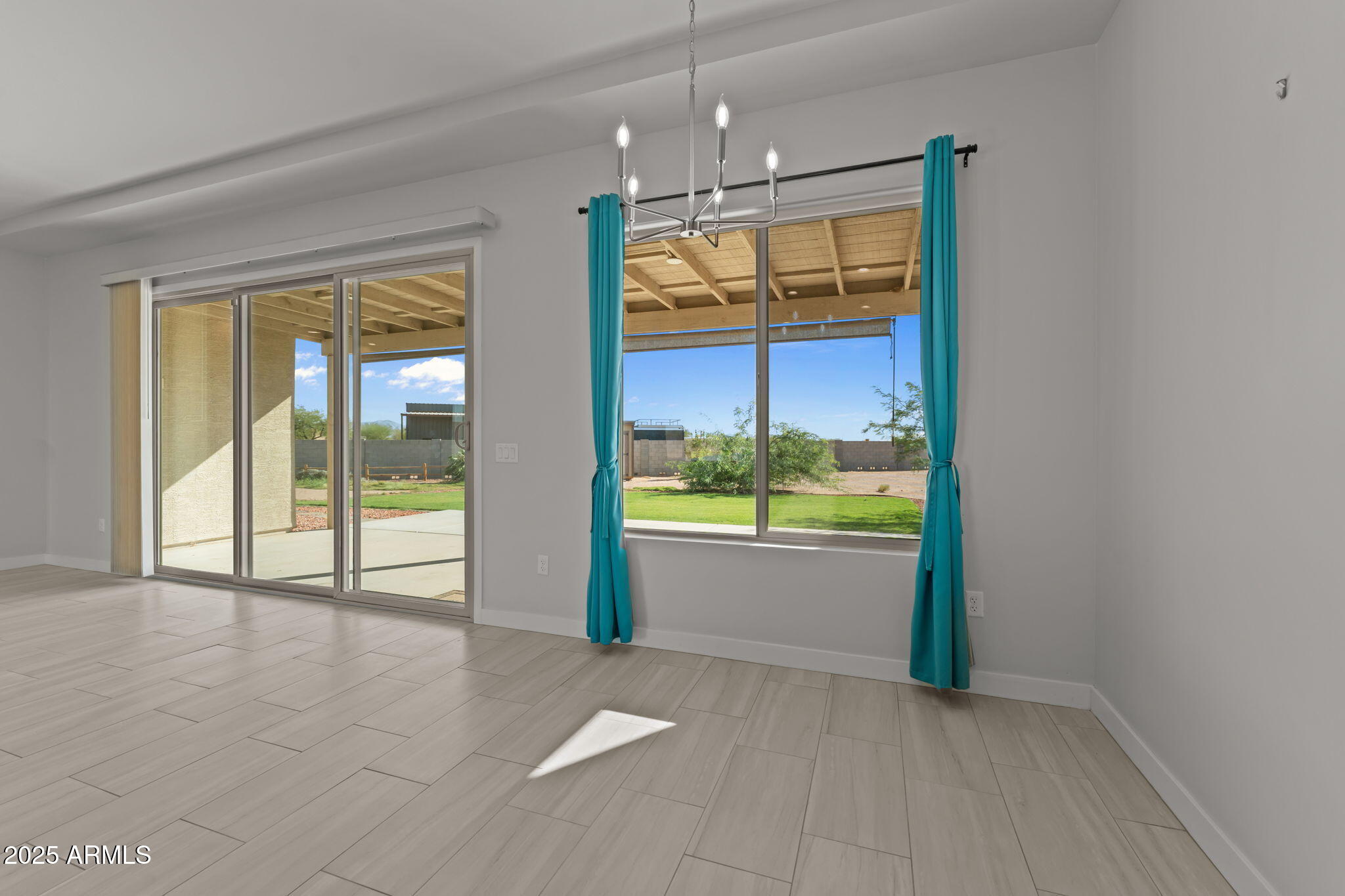 23012 Peak View Road Wittmann, AZ 85361 - Photo 16 of 44 a view of an empty room and window