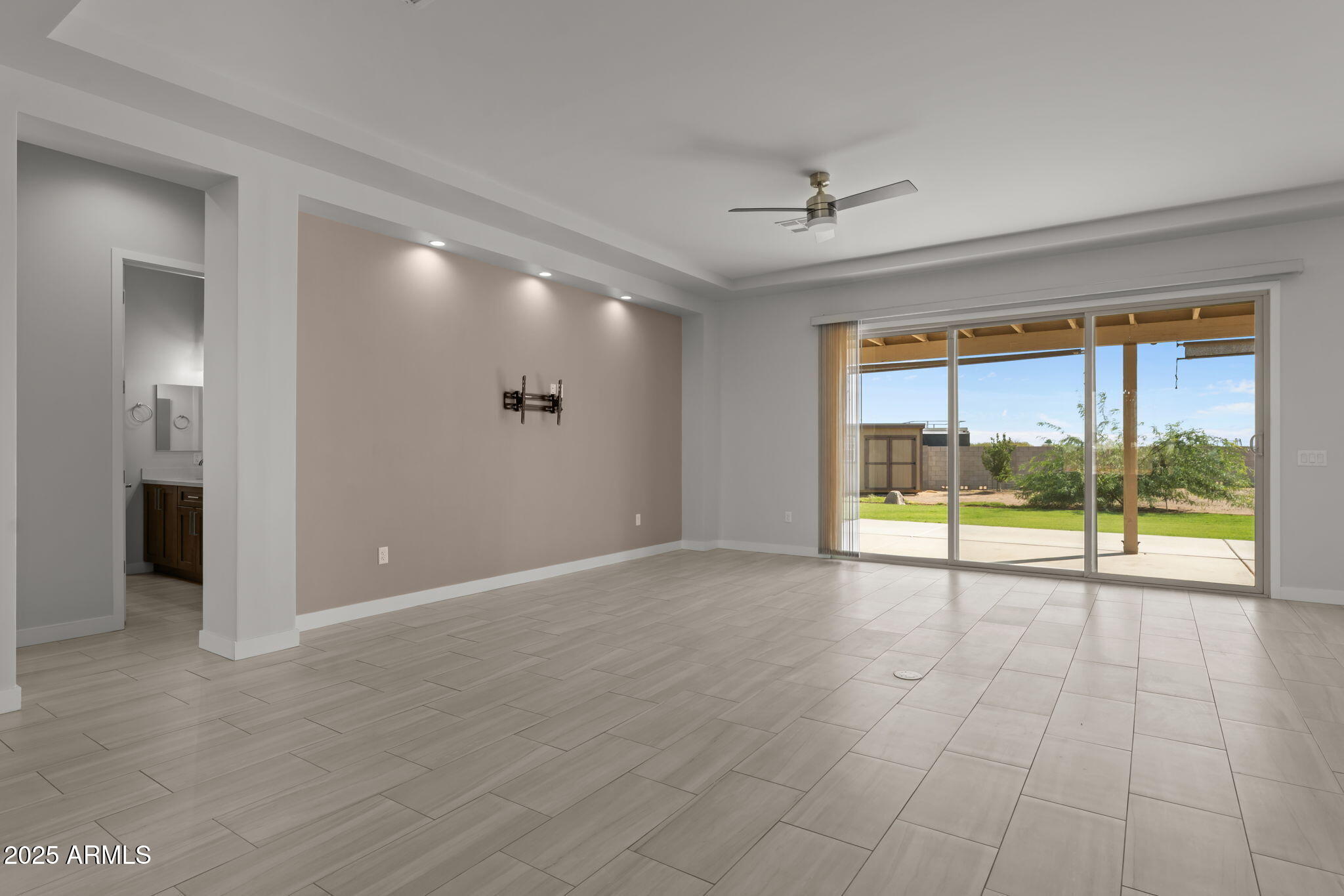 23012 Peak View Road Wittmann, AZ 85361 - Photo 17 of 44 wooden view of an empty room with a window