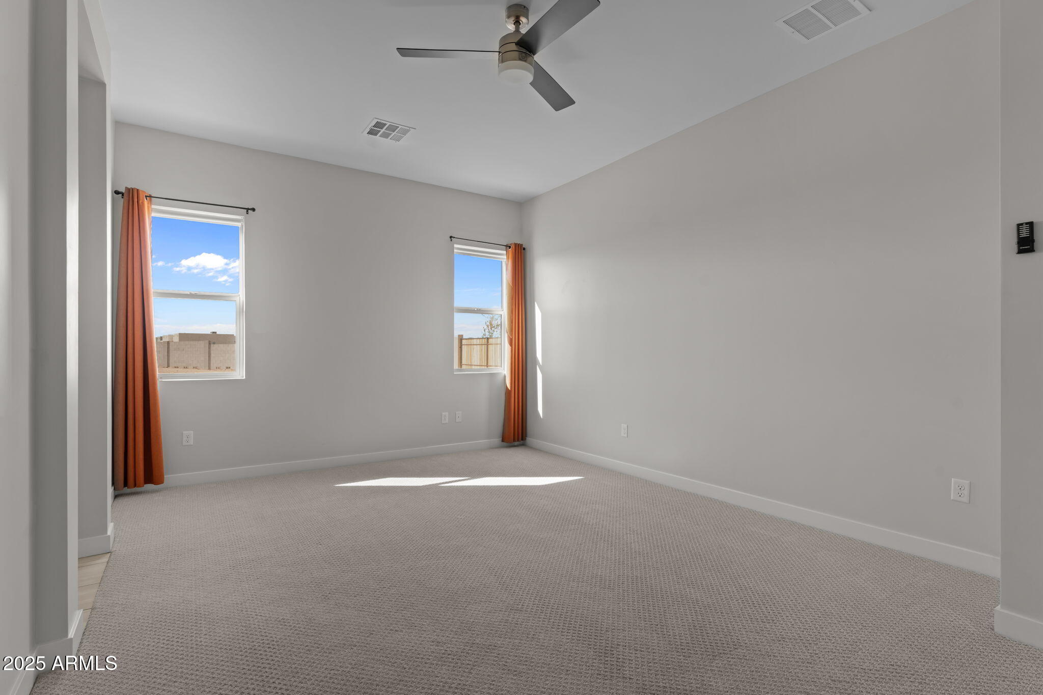 23012 Peak View Road Wittmann, AZ 85361 - Photo 18 of 44 a view of an empty room with a window