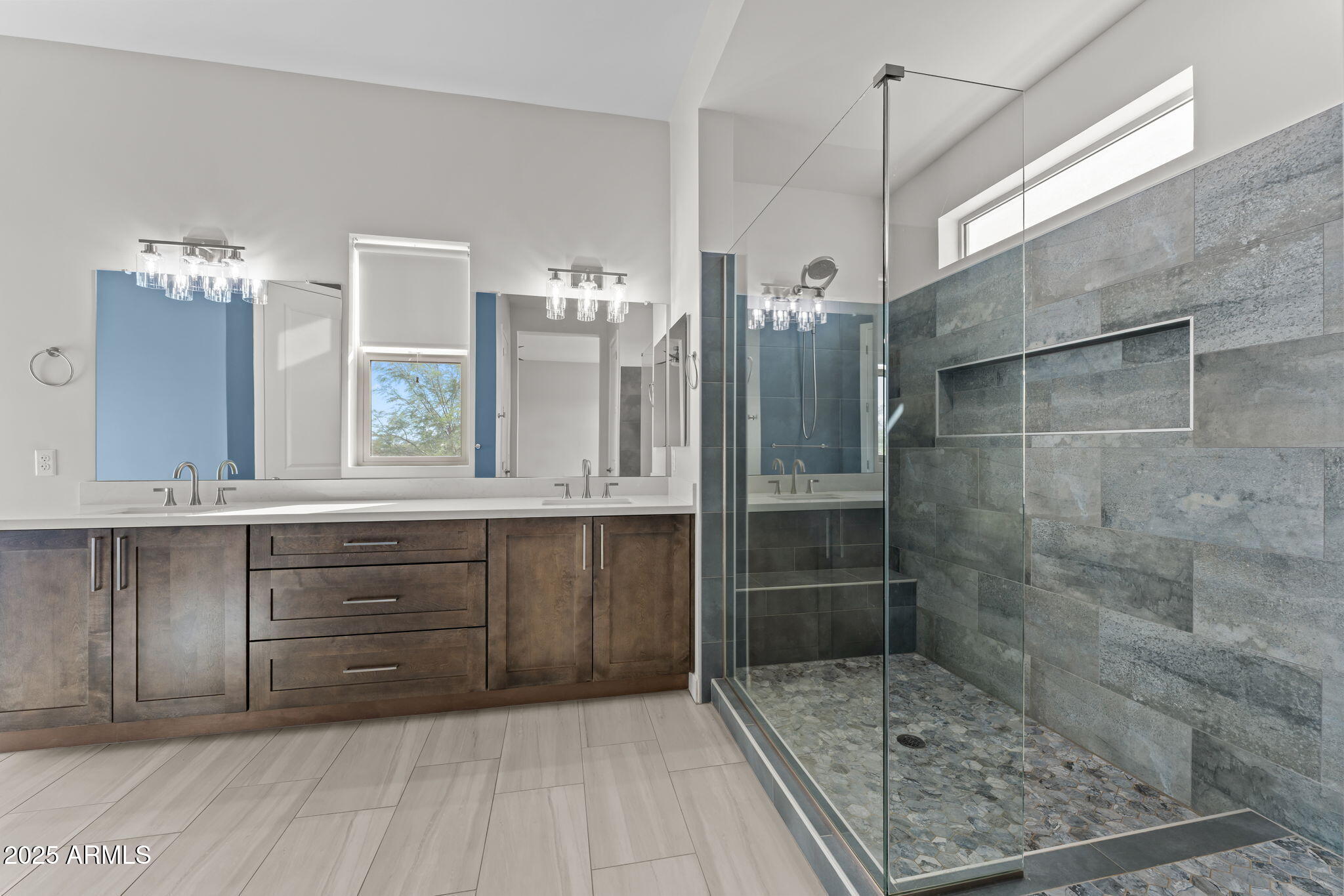 23012 Peak View Road Wittmann, AZ 85361 - Photo 19 of 44 a bathroom with a shower sink and mirror