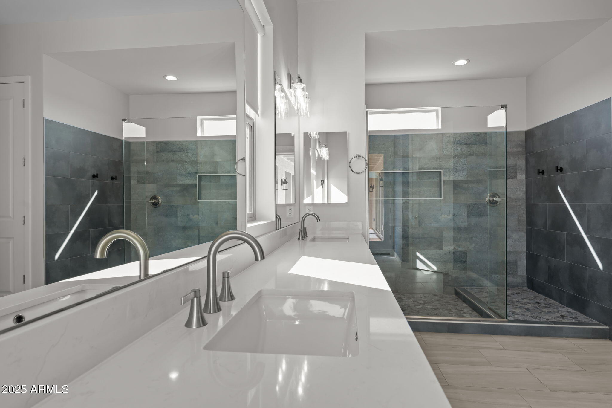 23012 Peak View Road Wittmann, AZ 85361 - Photo 20 of 44 a bathroom with a sink and a shower