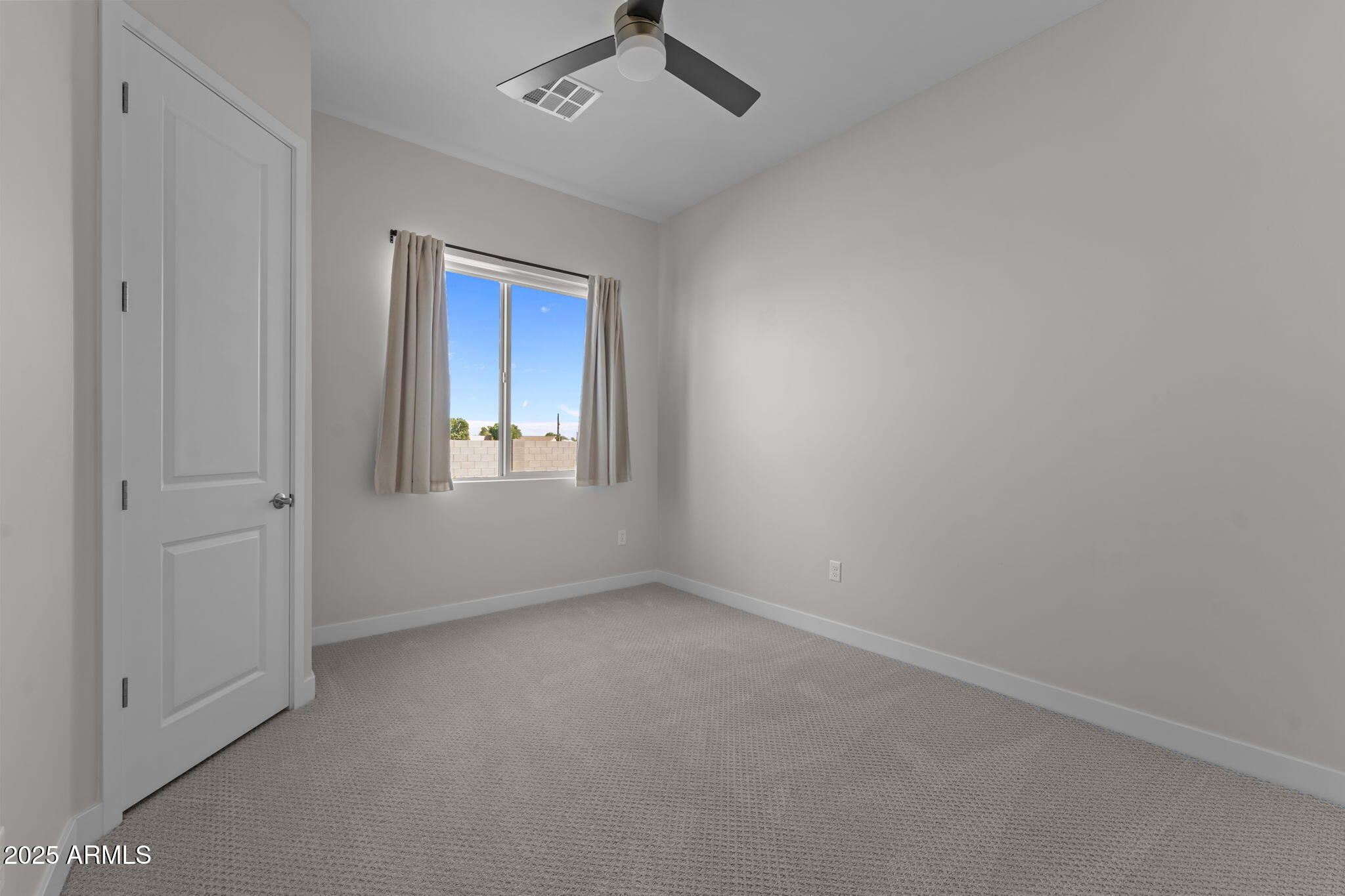 23012 Peak View Road Wittmann, AZ 85361 - Photo 24 of 44 a view of an empty room with a window