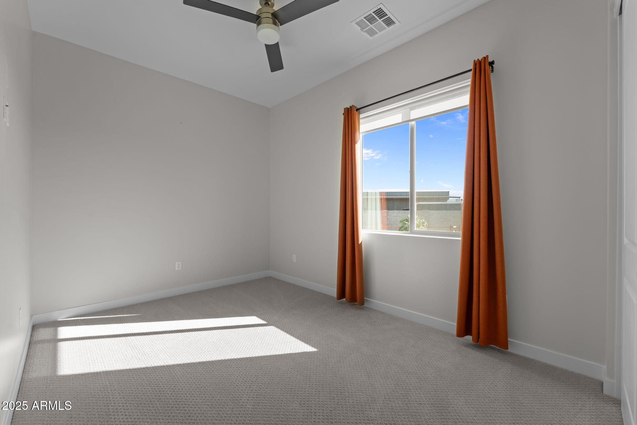 23012 Peak View Road Wittmann, AZ 85361 - Photo 25 of 44 a view of empty room with ceiling fan