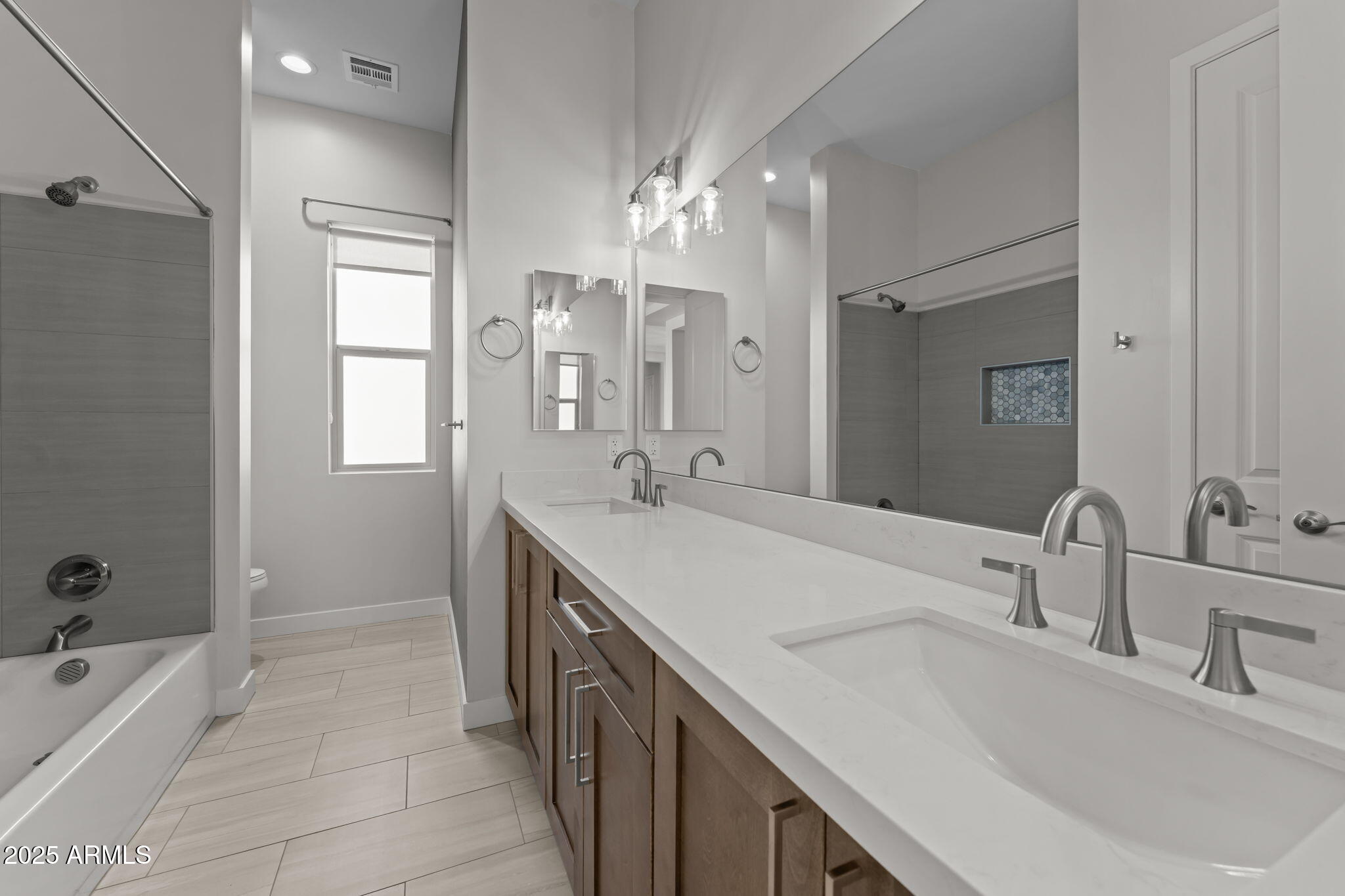 23012 Peak View Road Wittmann, AZ 85361 - Photo 26 of 44 a bathroom with a tub sink and mirror
