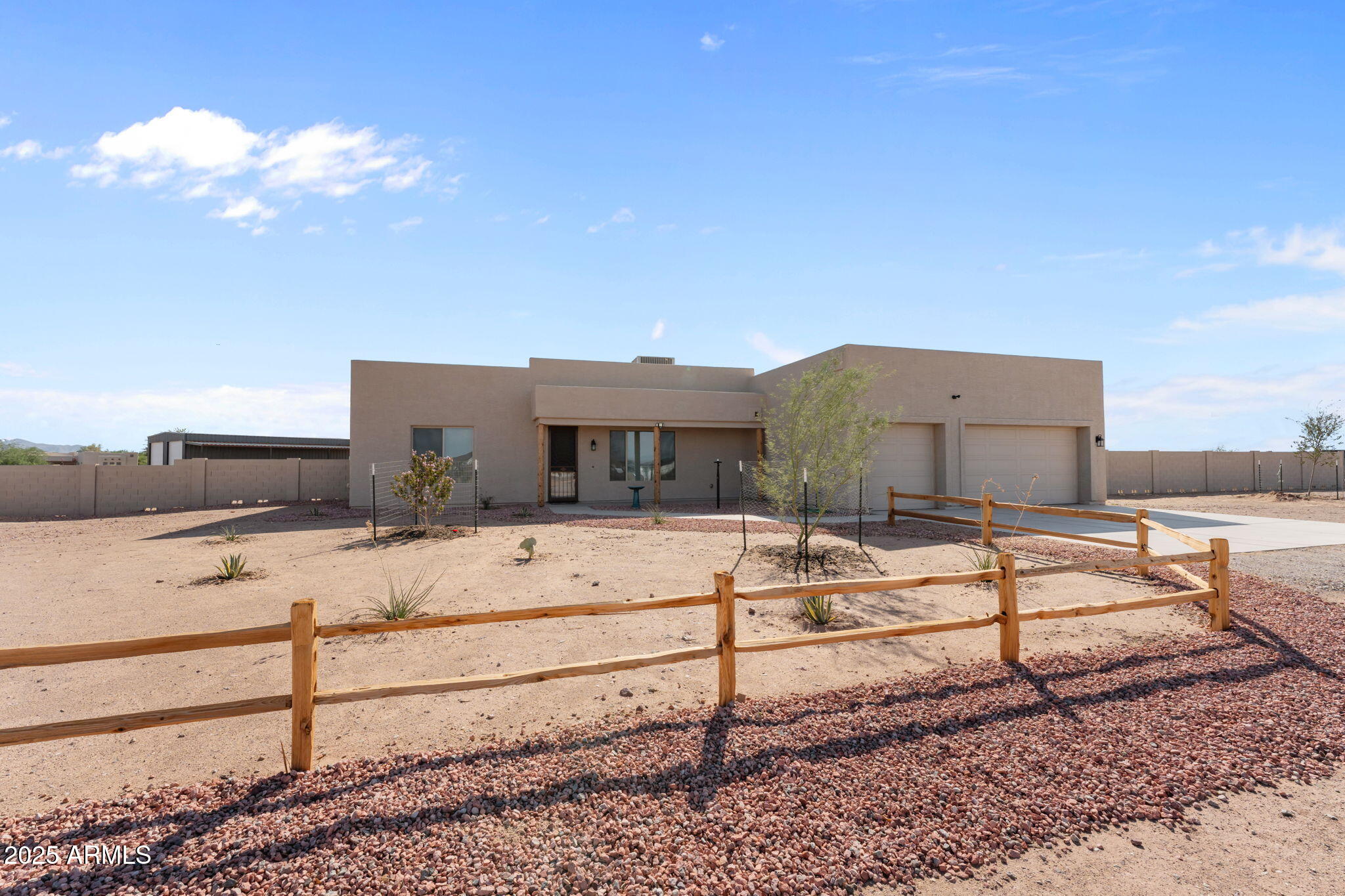 23012 Peak View Road Wittmann, AZ 85361 - Photo 40 of 44 a view of a house with a backyard