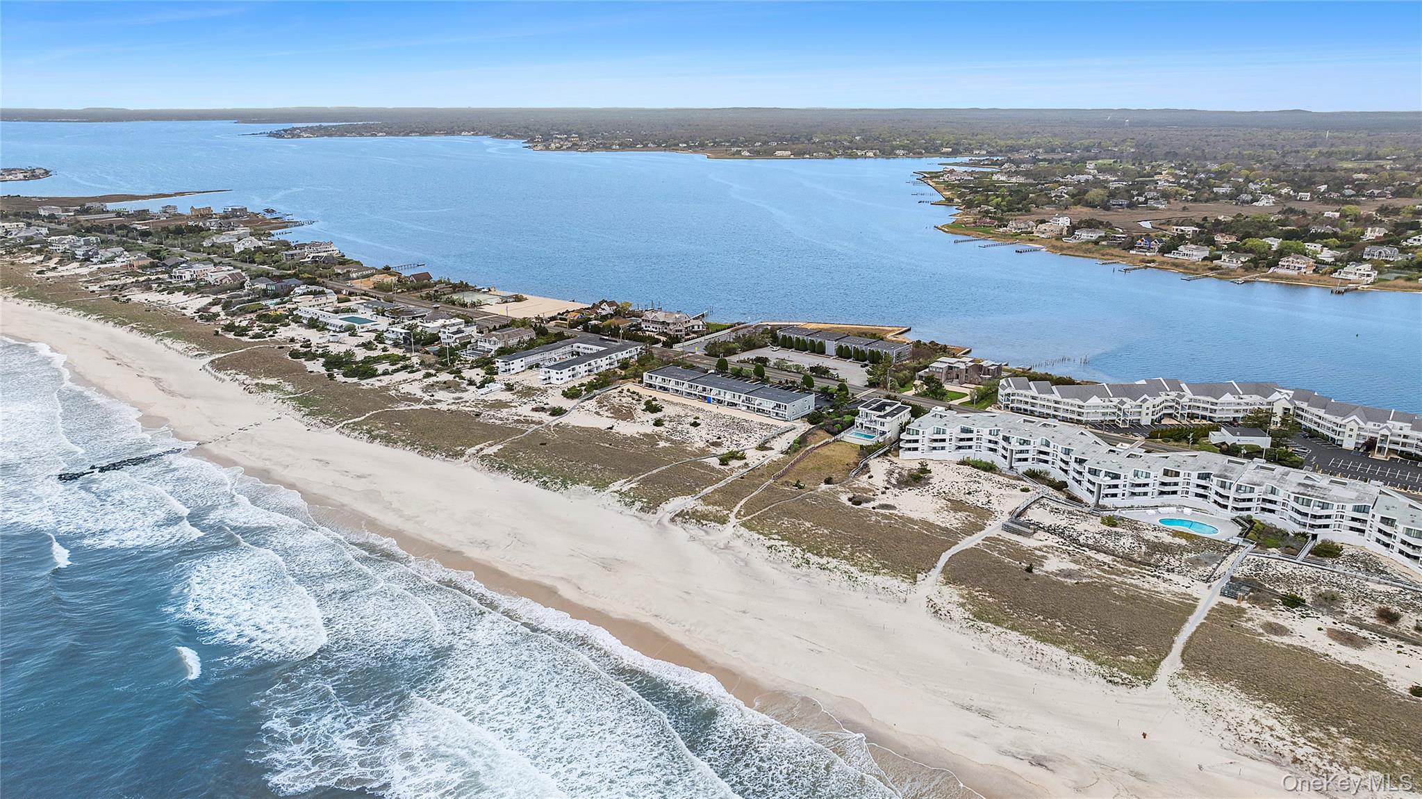 279 Dune Road, Unit 2 Westhampton Beach, NY 11978 - Photo 39 of 45 an aerial view of beach and ocean