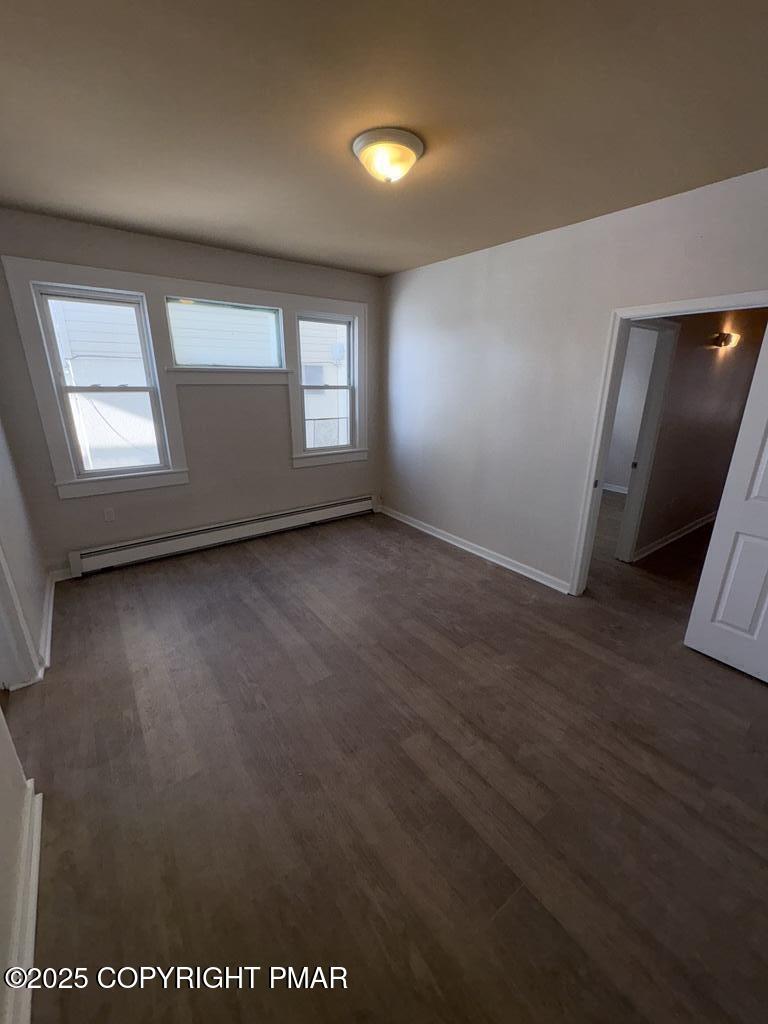 532 Cherry Street, Unit A Scranton, PA 18505 - Photo 12 of 23 an empty room with wooden floor and windows
