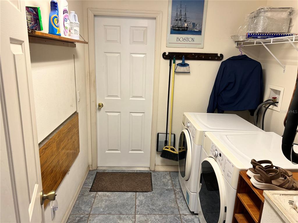 1995 East Newhaven Street Inverness, FL 34453 - Photo 45 of 48 a utility room with dryer and washer