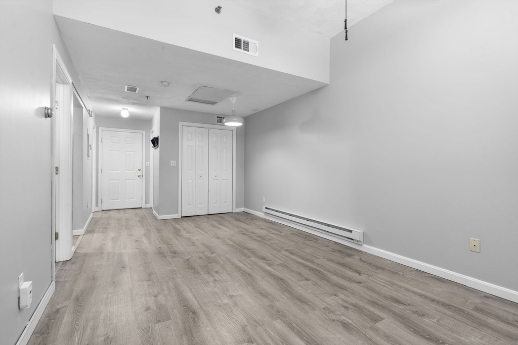 19 Washington Street, Unit 2 Haverhill, MA 01832 - Photo 10 of 20 an empty room with wooden floor