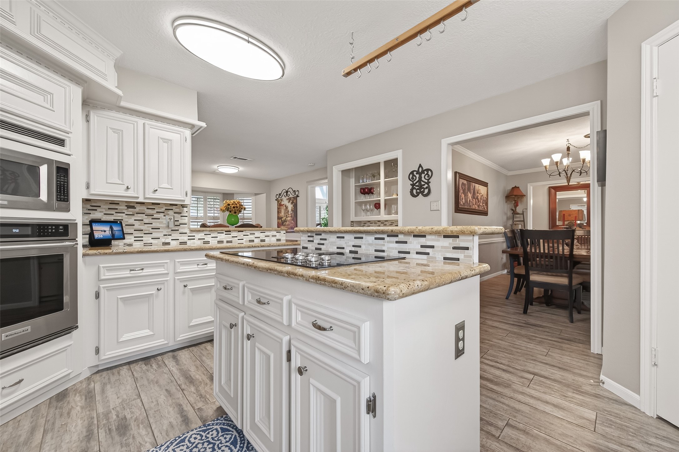 7310 Maidstone Lane Houston, TX 77095 - Photo 11 of 40 Recent convention oven, dishwasher and disposal. Open to the formal dining room for easy access. There is also a pot rack above the island.
