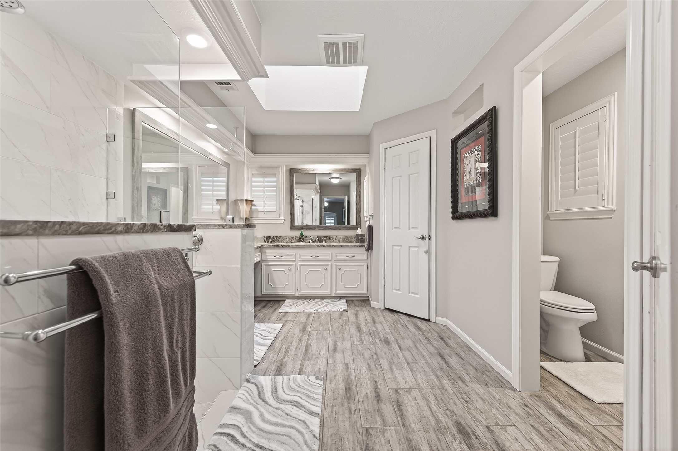 7310 Maidstone Lane Houston, TX 77095 - Photo 18 of 40 Modern look updated primary bath with his and hers closets.