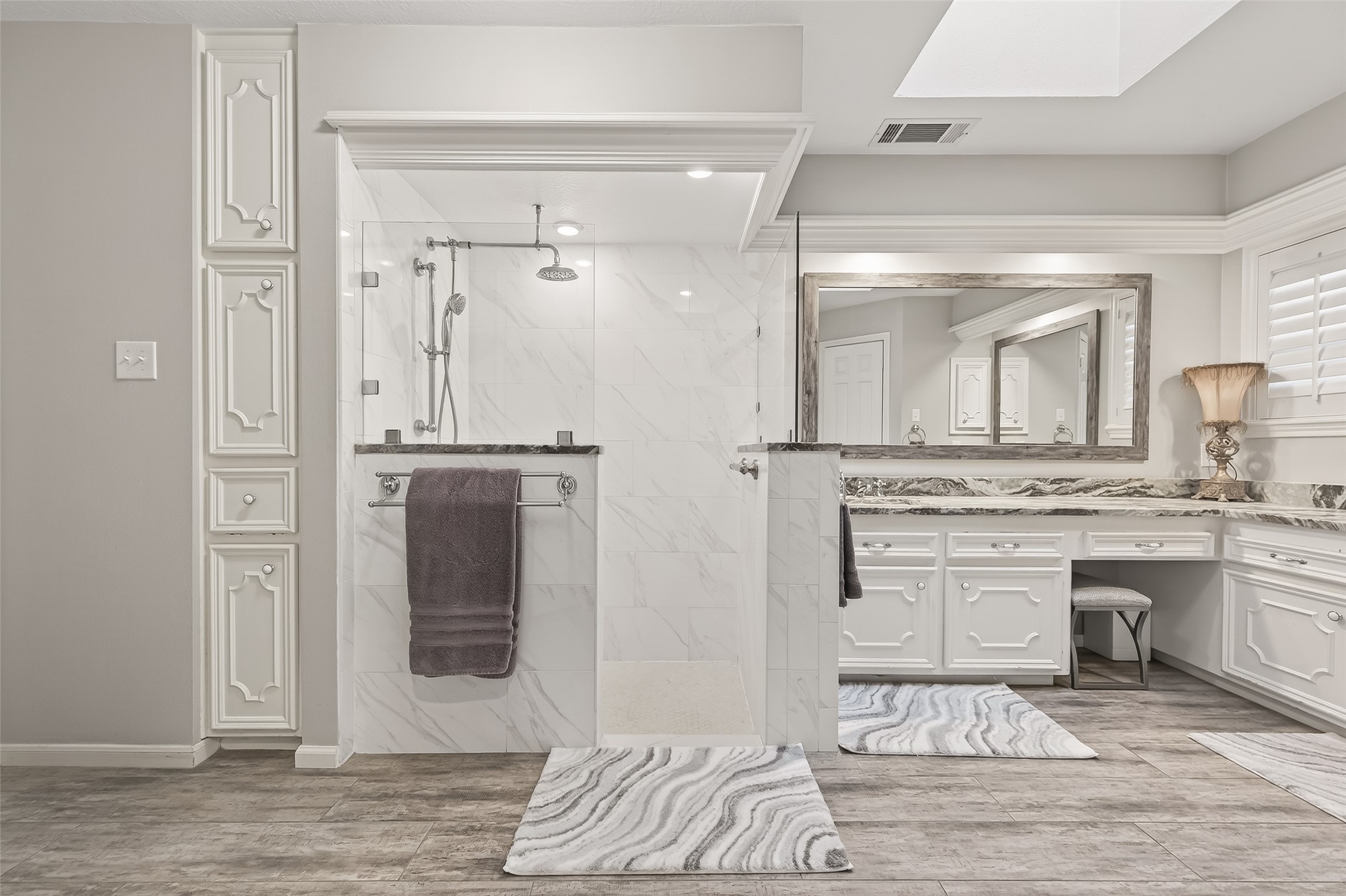 7310 Maidstone Lane Houston, TX 77095 - Photo 19 of 40 The large shower features floor to ceiling marble and frameless glass. There is also a skylight.