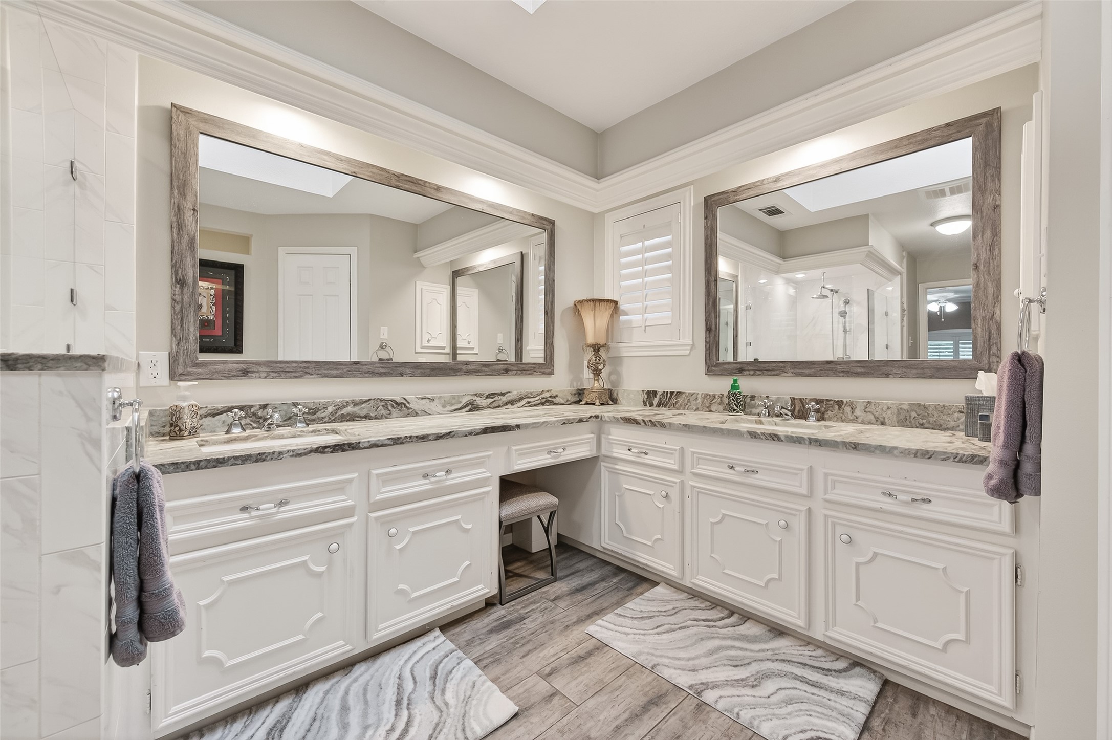 7310 Maidstone Lane Houston, TX 77095 - Photo 20 of 40 Double sinks with chrome fixtures, custom mirrors and a vanity.