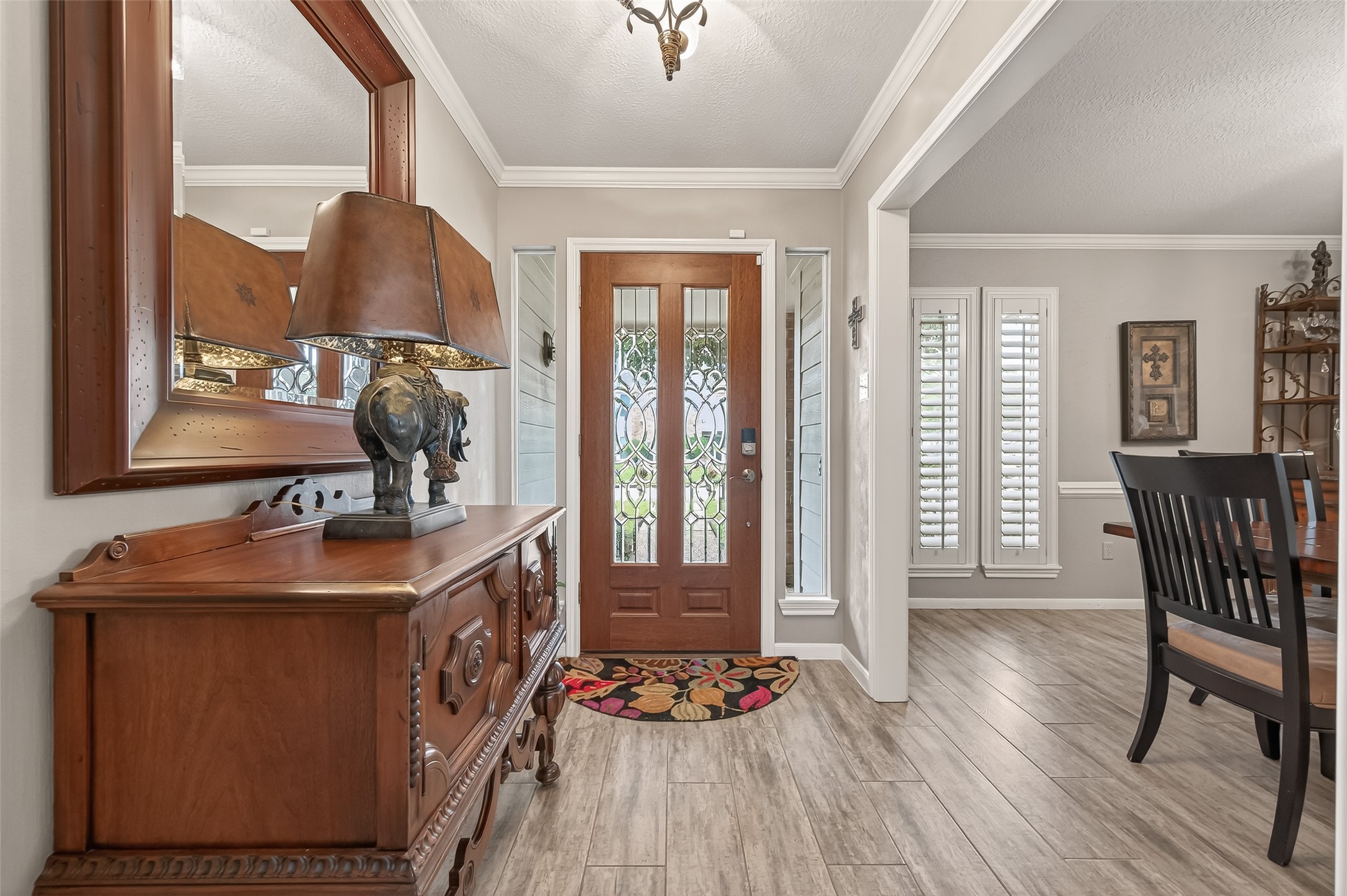 7310 Maidstone Lane Houston, TX 77095 - Photo 3 of 40 Welcome inside through the glass front door and into the foyer. Easy to maintain wood-like tile throughout the downstairs.