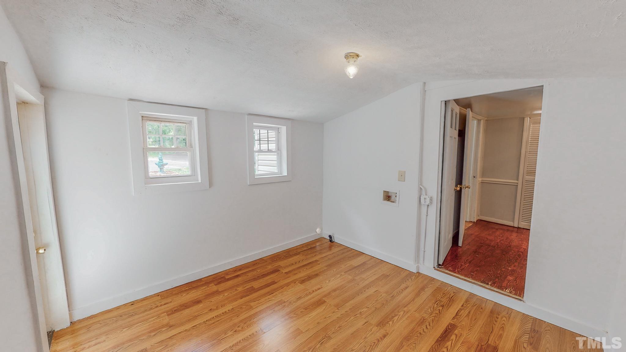 1556 Gentry-Dunkley Road Roxboro, NC 27574 - Photo 14 of 47 a view of empty room with wooden floor