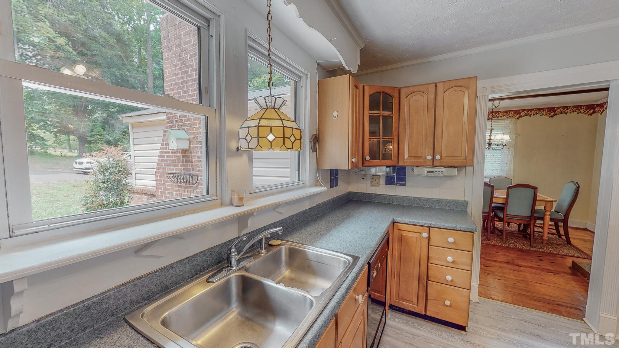 1556 Gentry-Dunkley Road Roxboro, NC 27574 - Photo 25 of 47 a kitchen with a window a sink and counter space