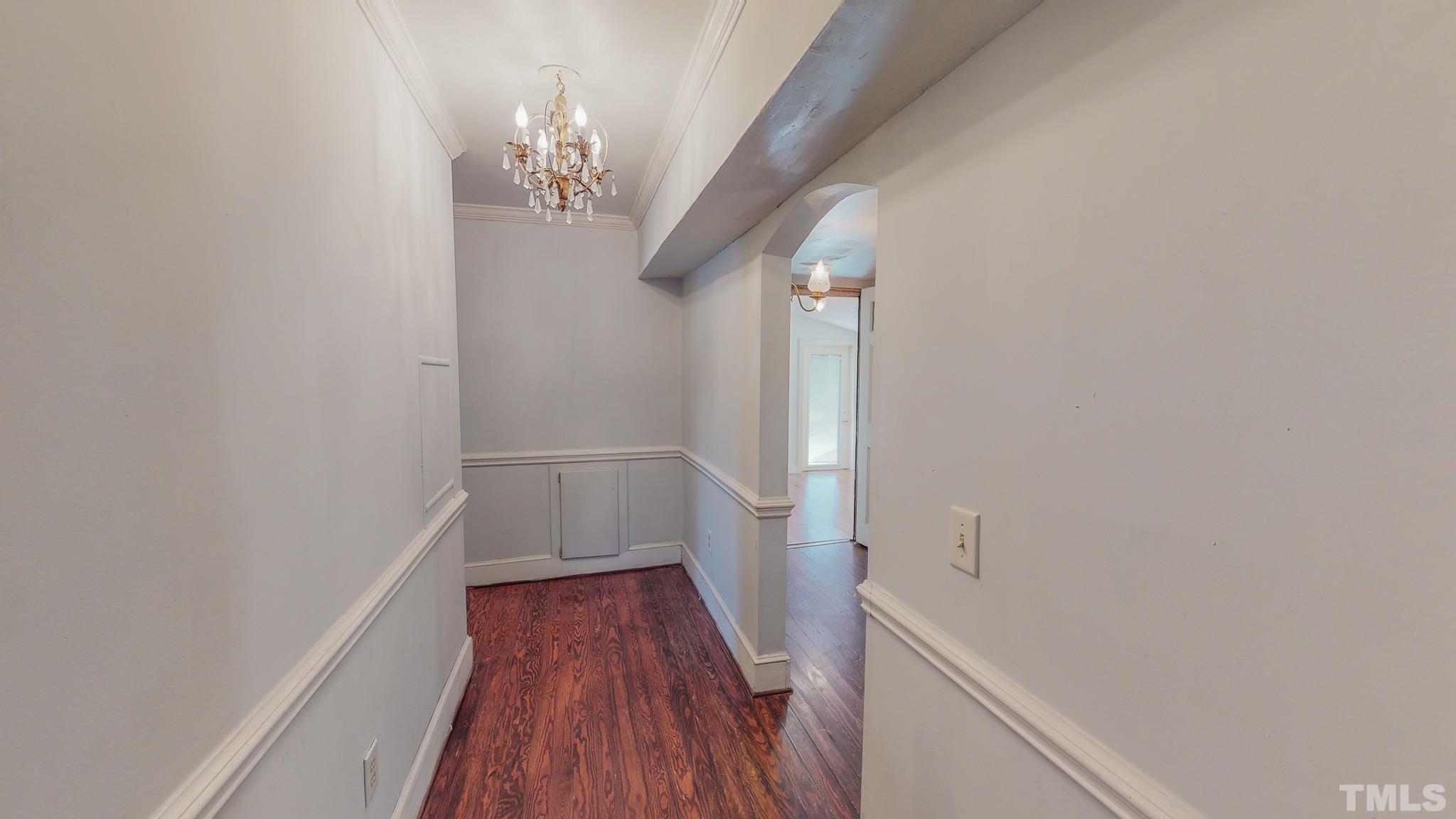 1556 Gentry-Dunkley Road Roxboro, NC 27574 - Photo 35 of 47 a view of a hallway with wooden floor and staircase