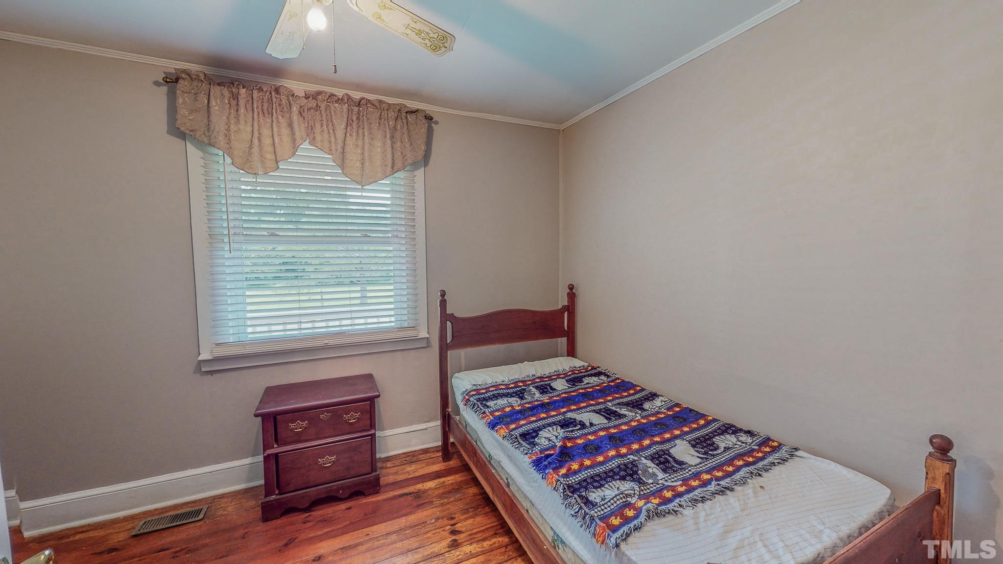 1556 Gentry-Dunkley Road Roxboro, NC 27574 - Photo 38 of 47 a view of room with window and wooden floor