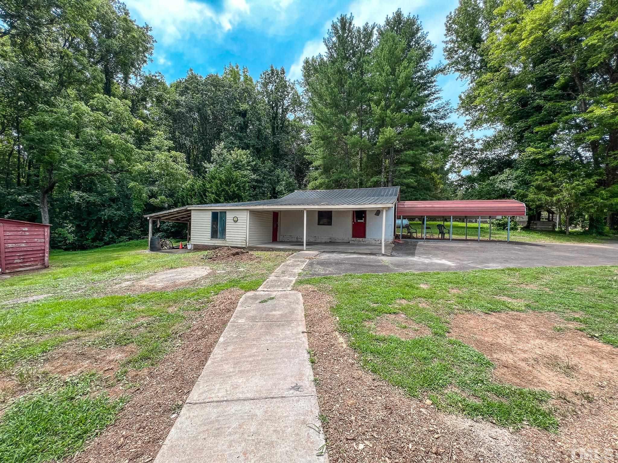 1556 Gentry-Dunkley Road Roxboro, NC 27574 - Photo 45 of 47 a front view of house with yard and green space
