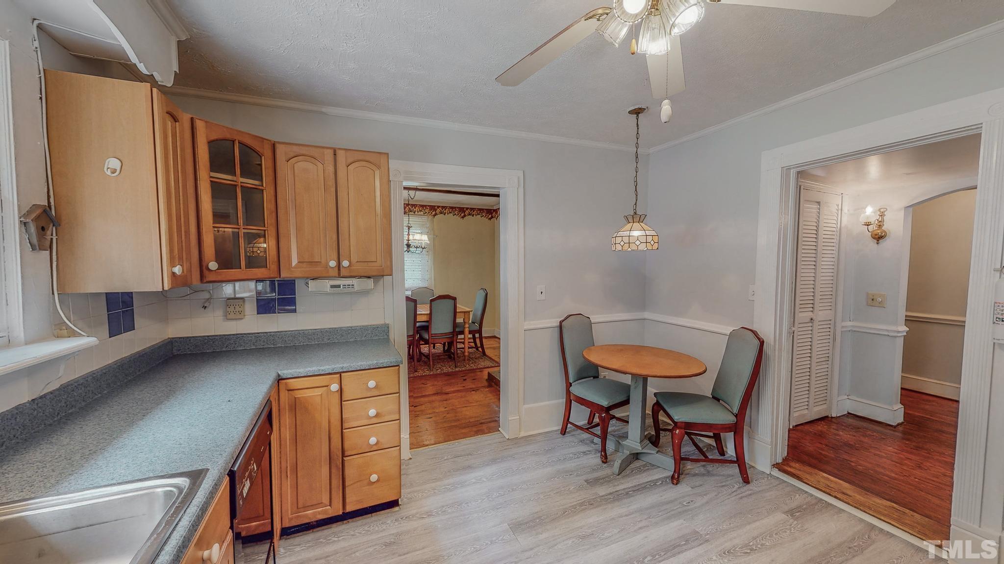 1556 Gentry-Dunkley Road Roxboro, NC 27574 - Photo 8 of 47 a dining room with furniture and wooden floor