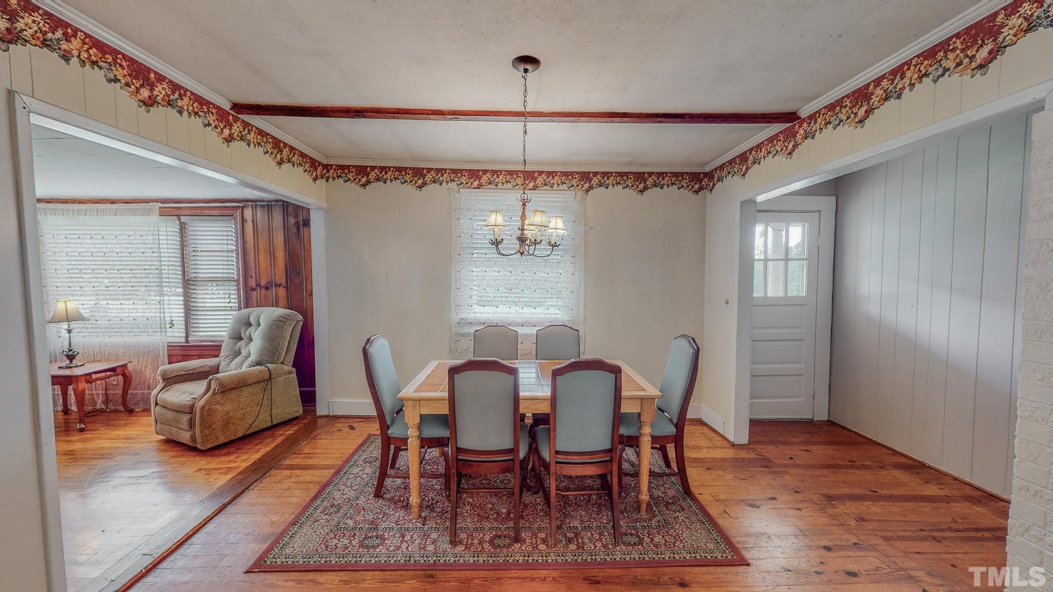1556 Gentry-Dunkley Road Roxboro, NC 27574 - Photo 10 of 47 a view of a dining room with furniture