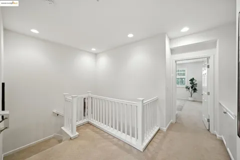 a bedroom with a bed and a potted plant